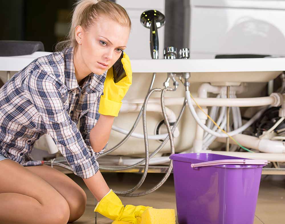 woman mopping up standing water