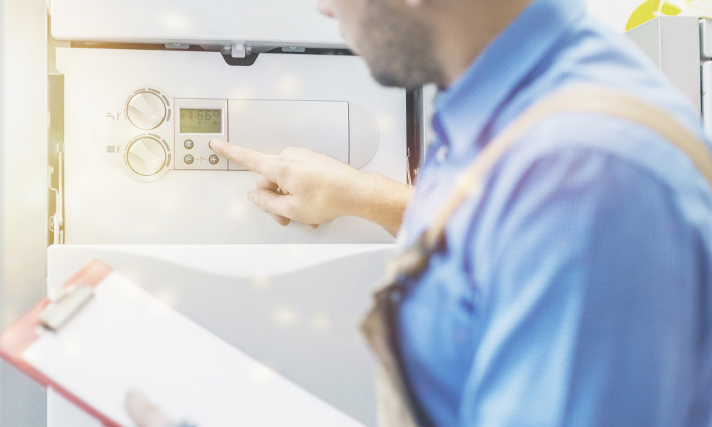 plumber inspecting a tankless water heater in Glen Ellyn, IL