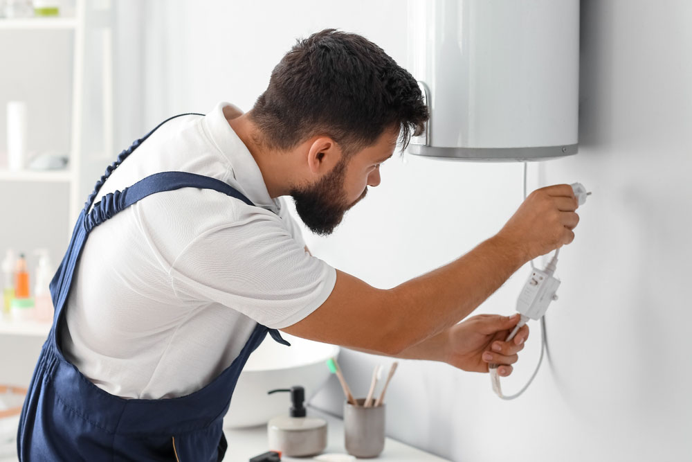 plumber installing a water heater